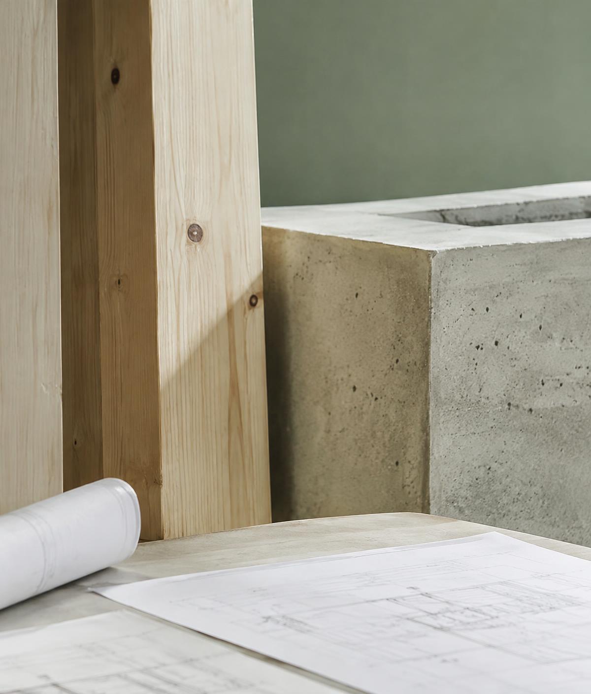 Timber, concrete and drawings on a work table